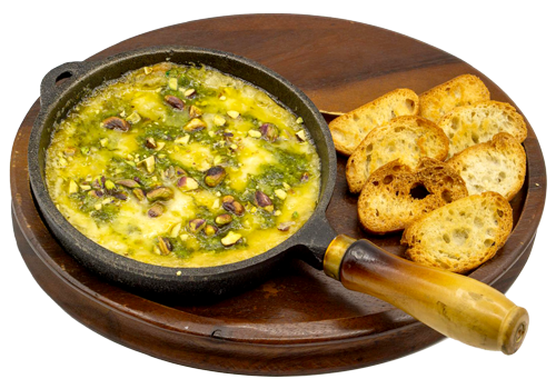 Provoleta con pesto y pistacho